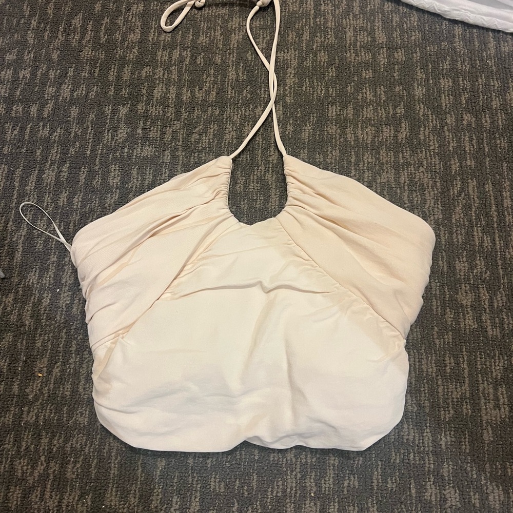 Off white womens crop top. Ties around neck and scrunches